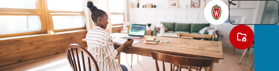 Sitting in front of her computer with a marker in her hand answring the AWS certified security exam