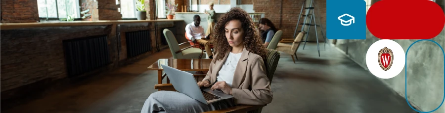 sitting with a Laptop on her lap and helping to Kickstart Your Journey to Cybersecurity Success with a Bootcamp