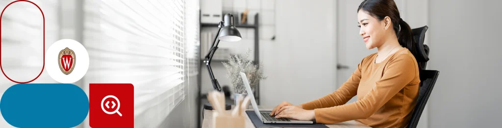 smiling while typing on her computer 